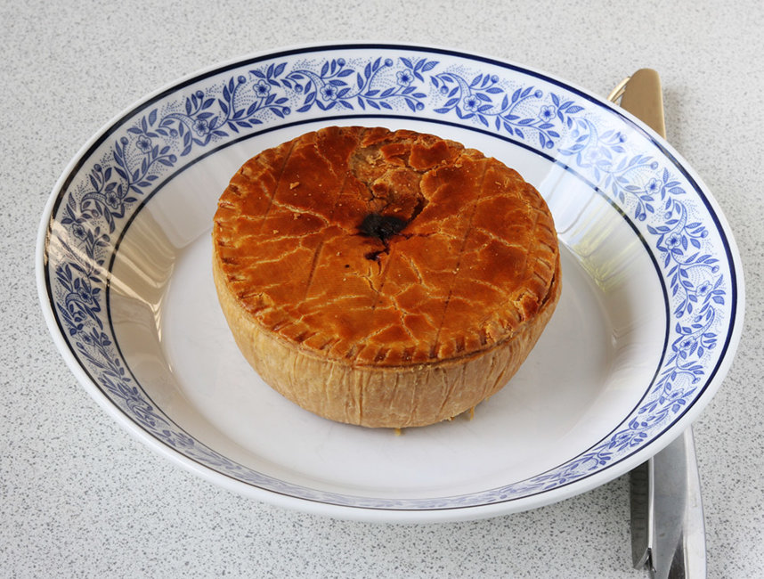 Steak and kidney pie browned.